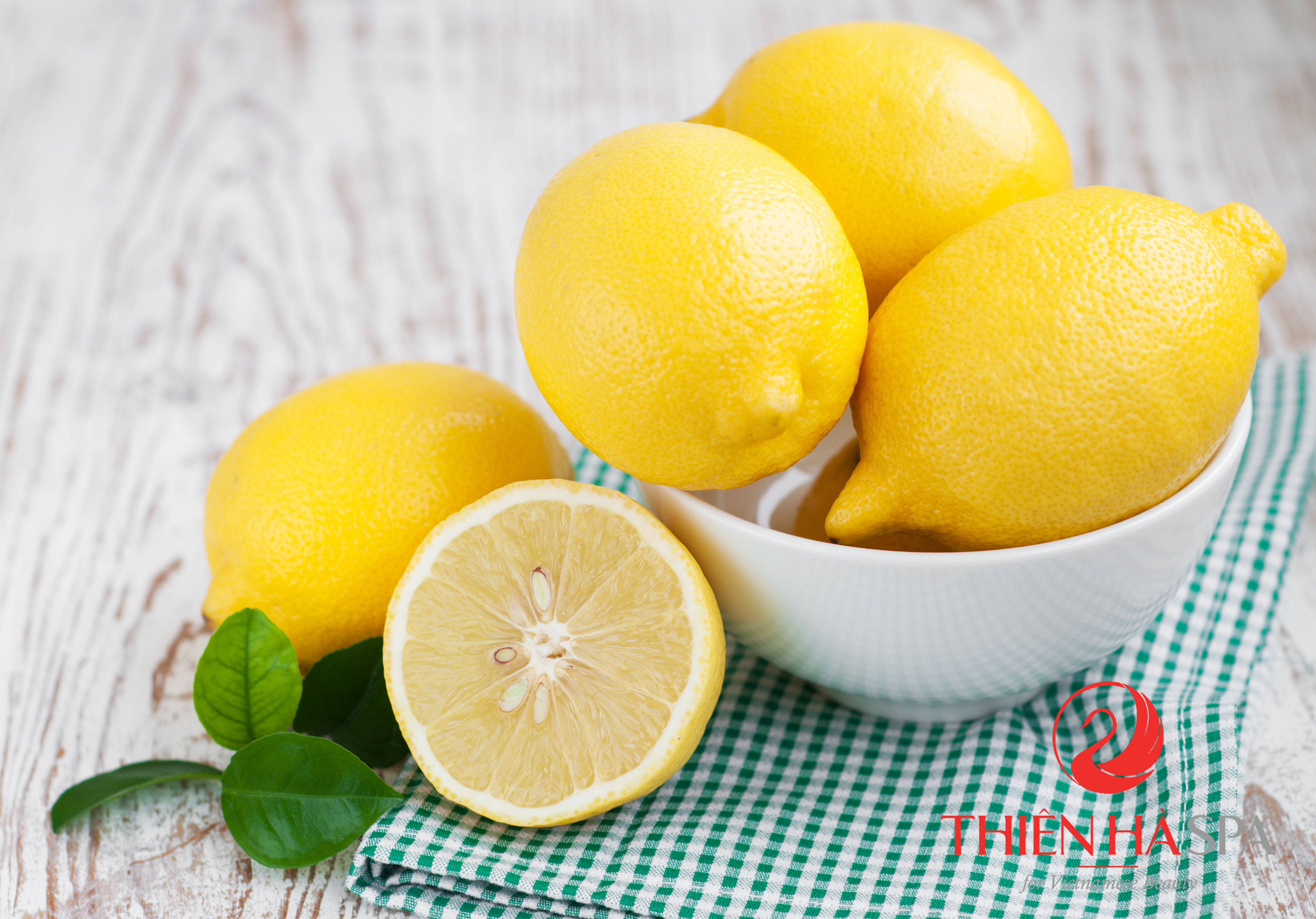 Bowl with Lemons  on a wooden background